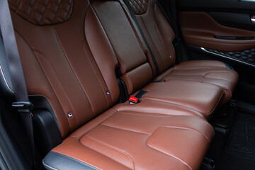 Naklejka na ściany i meble Interior of a modern luxury car. Leather car seat.