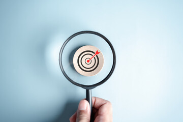 Magnifier glass focus to target icon which for planning development leadership and customer target...