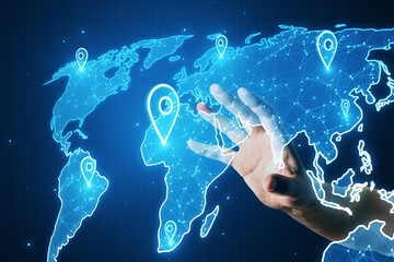 Close up of hand using glowing map with location pins on blurry blue background. GPS and navigation concept.