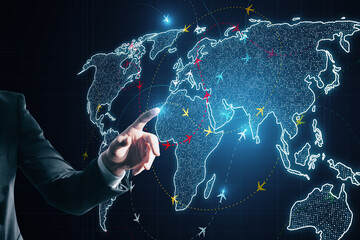 Close up of businessman hand using glowing digital map with ariplane connections on dark...
