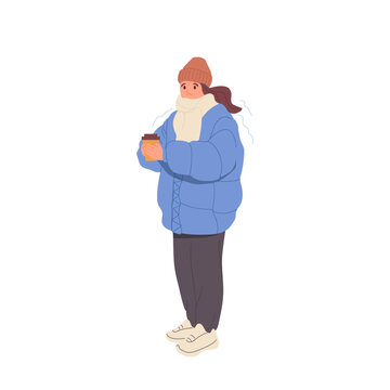 Cute freezing woman wearing winter clothes holding cup of hot takeaway coffee to keep warm