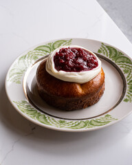 cheesecake with cream and cranberries