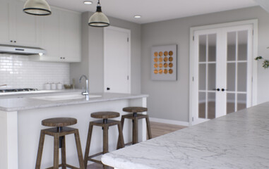 Large white kitchen with island and all necessary appliances. 3d rendering.