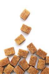 Brown sugr cubes on white
