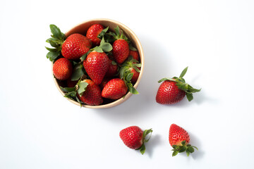 Fresh fruit strawberries in paper packaging on a white background. Top view, flat lay