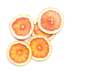 Grapefruit slices on white background.