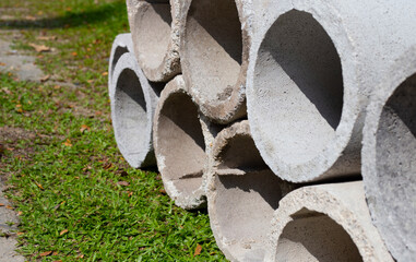 Grey concrete pipe for the construction