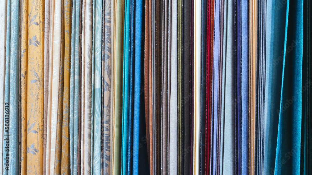 Poster mix colorful hanging vertical stripe textile, fabrics, cloths on the rack. texture of multicolored f