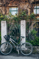 Fototapeta na wymiar the bicycle stands at the fence of the old European house. Zagreb.Croatia