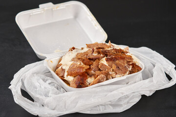 Doner kebab with salad in a plastic box.