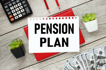 pension plan white sheet of paper with text. on a red notepad near the calculator