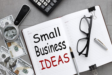 Small business ideas. notepad on a gray background. text on white paper