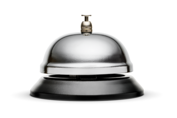 Reception or service bell with a shiny metal surface and a black plastic base. Isolated on white.