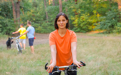 Fototapeta na wymiar portrait of a woman on a bicycle