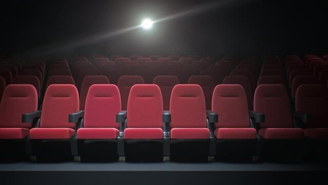 Empty cinema with a projector playing a movie in this atmospheric footage. The camera slowly pans across the vacant seats, emphasizing the eerily silent and deserted ambiance of the once lively space.