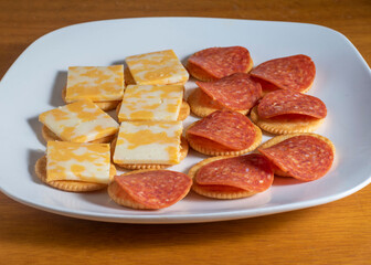 Fototapeta na wymiar crackers top with colby jack cheese and pepperoni