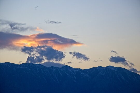 The sun sets over the Sierra Nevada Mountains, as seen from near Bishop, one of the larger cities in the Eastern Sierra region. © Andrew