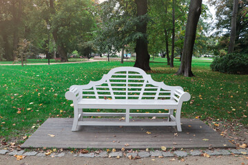Beautiful white bench in public city park
