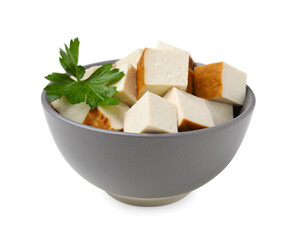 Bowl of delicious smoked tofu cubes with parsley isolated on white