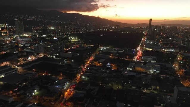 San Jose, Costa Rica aerial hyperlapse. Drone timelapse moving over city dusk to night.