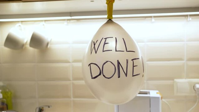 balloon with well done written on it to celebrate