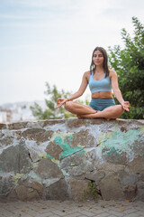 Young woman practicing mindfulness, outdoors.