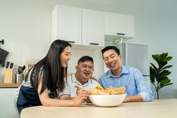 Asian happy family, mature parents baking bakery with son in kitchen.