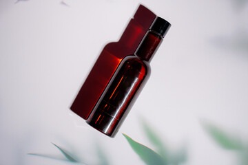 Cosmetic bottles made of dark amber glass on a white background