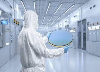 Worker or engineer wears medical protective suit or coverall suit with silicon wafer - obrazy, fototapety, plakaty