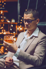 Businessman pouring whiskey victory drink