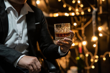 Businessman pouring whiskey victory drink