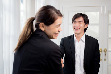 Young businesswoman and businessman break and talking with relax near window at office, happy couple discussion and leisure with cheerful together, coworker and friendly, two people, business concept.