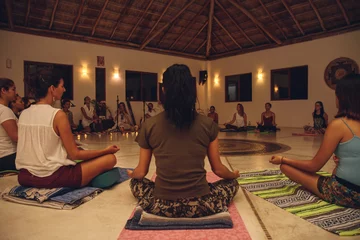 Foto auf Acrylglas many people in lotus position in a meditation ceremony © Juanmarcos