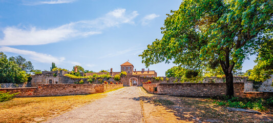 Castle of Tata city in Hungary. Amazing water fort next to Old lake. Built in 13th century near...