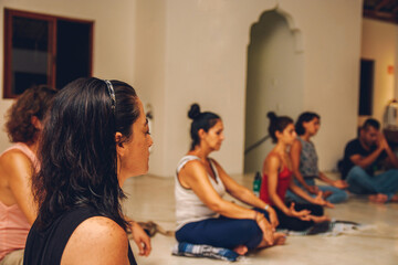 relaxed woman in a meditation with musical instruments