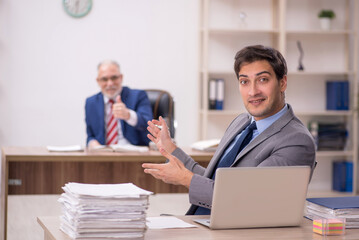 Two male colleagues sitting in the office