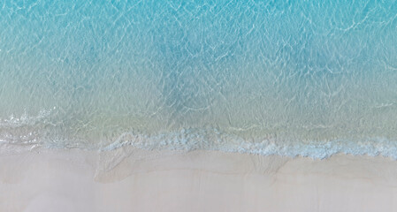 Aerial view with beach in wave of turquoise sea water shot, Top view of beautiful white sand background