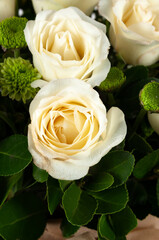 Festive bouquet with white roses as a gift. Beautiful flowers.