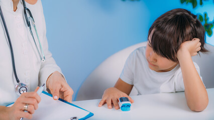 Pulmonology pediatrician measuring blood oxygen levels with pulse oximeter