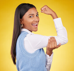 Arm, flex and portrait of woman in studio for winner, success and empowerment. Gender equality, satisfaction and champion with female on yellow background for pride, muscle strength and achievement