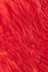 Wet red napkin on the table, close-up