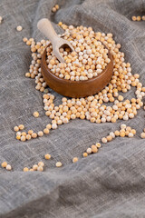 Obraz na płótnie Canvas Round yellow peas for cooking porridge