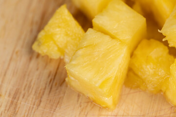 Sliced into pieces of fresh ripe peeled pineapple
