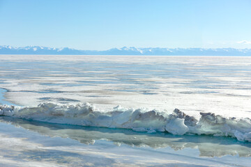 Fototapeta premium Frozen Lake and Snowy Mountains Winter Landscape