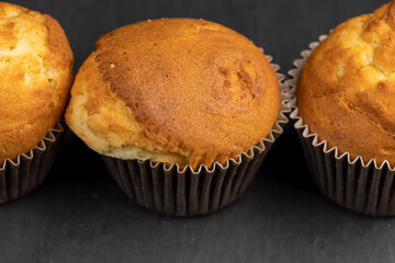 Soft and fresh fragrant wheat cupcake on a black stone