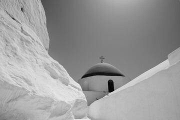 View of the top of an orthodox Greek church in Ios Greece in black and white