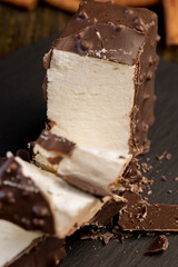 Fresh sweet cake with milk taste and aroma in chocolate glaze