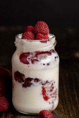 Fresh milk yogurt with whole fresh raspberries