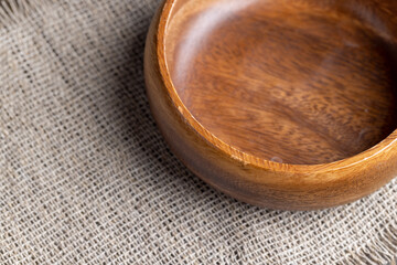 an old empty wooden bowl on the table