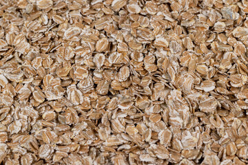 a bunch of fresh dry oatmeal flakes for making porridge